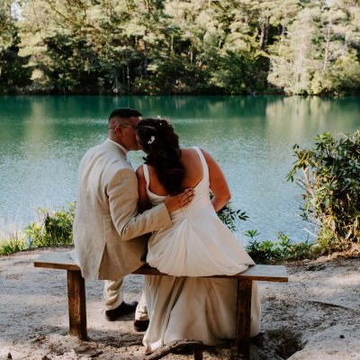 Wedding couple beside The Blue Pool