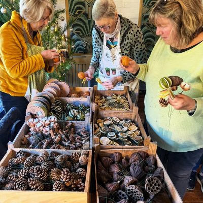Christmas workshop participants choosing items for wreaths