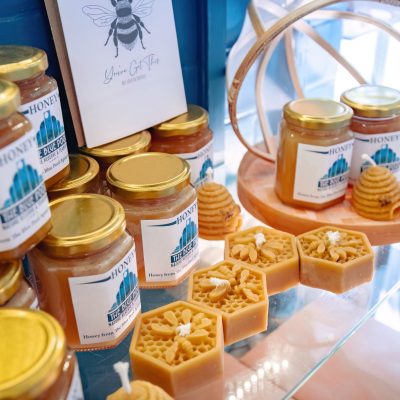 Jars of honey and bees wax candles