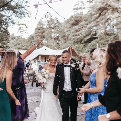 Wedding couple under confetti
