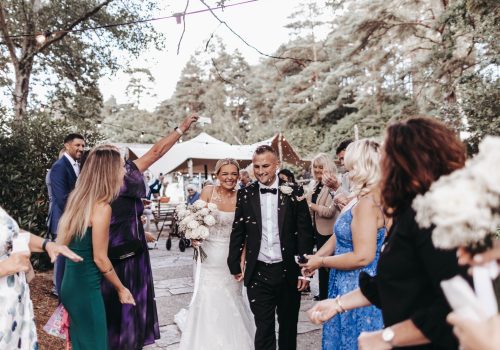 Wedding couple under confetti