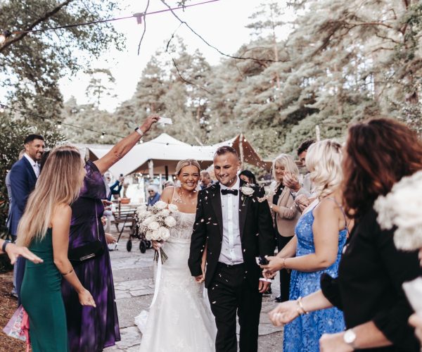 Wedding couple under confetti