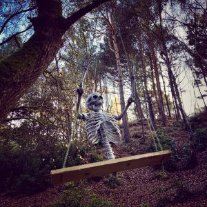 Skeleton on a tree swing