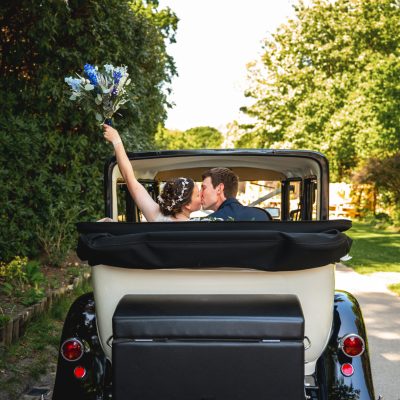 Wedding couple in car